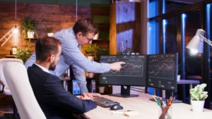 Alternatives to Nearshore Software Development: Finding the Right Fit for 2025 3 DevCrew I/O - business colleagues discussing together office night teamwork partnership